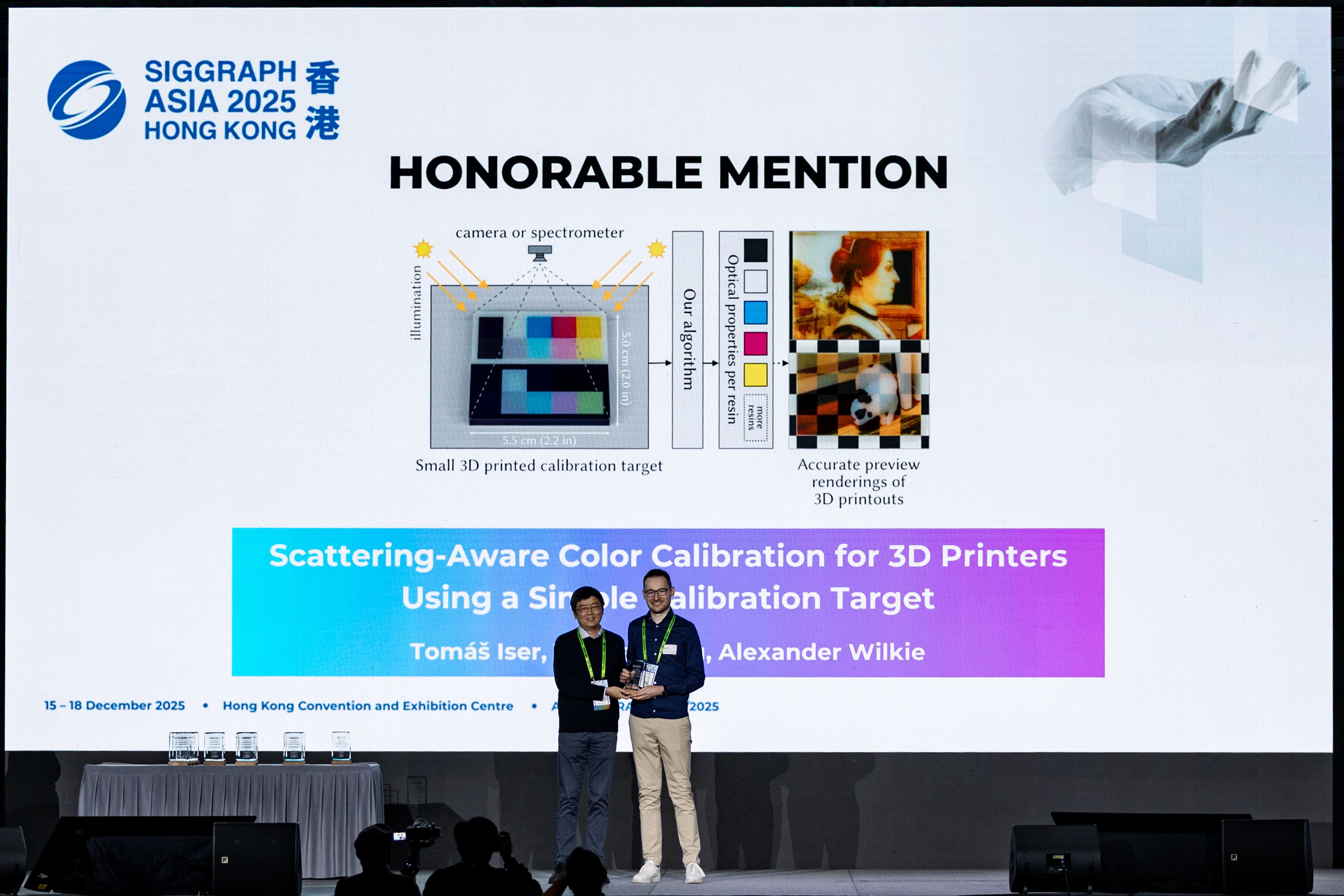 Tomas Iser receiving the Honorable Mention award on the stage of the SIGGRAPH Asia 2025 conference