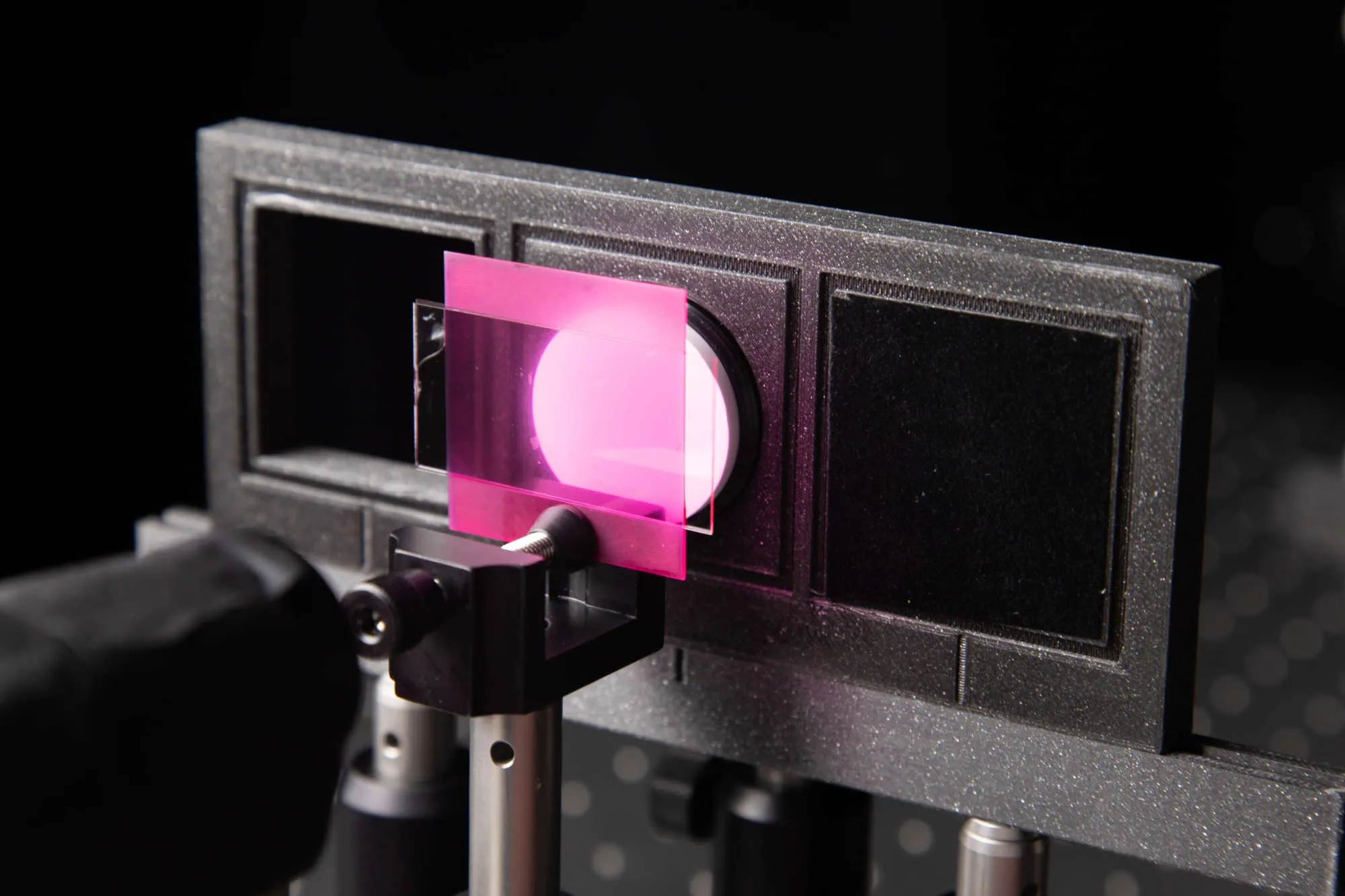 Measuring the reflectance of a magenta slab in front of a white background using a custom 3D printed holder for a Spectralon reference.